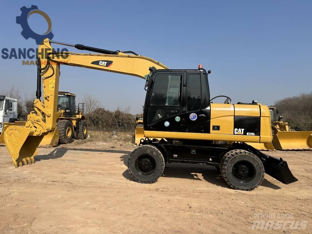 CAT M 320 D2 Excavadoras de ruedas