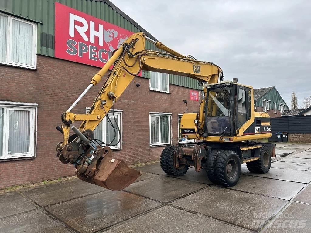 CAT M315 +ROTO CE Excavadoras de ruedas