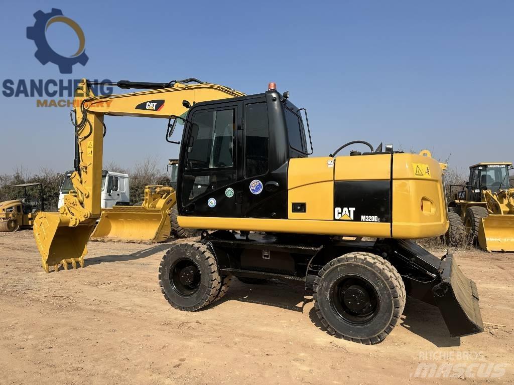 CAT M 320 D2 Excavadoras de ruedas