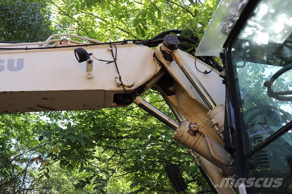 Komatsu PW 140-7 Retrocargadoras