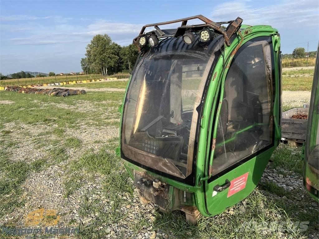 John Deere 1010E Cabinas e interior