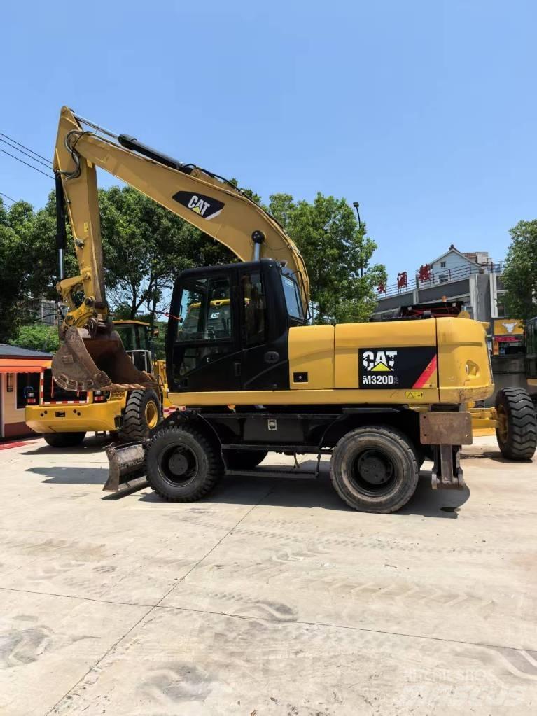 CAT M 320 Excavadoras de ruedas