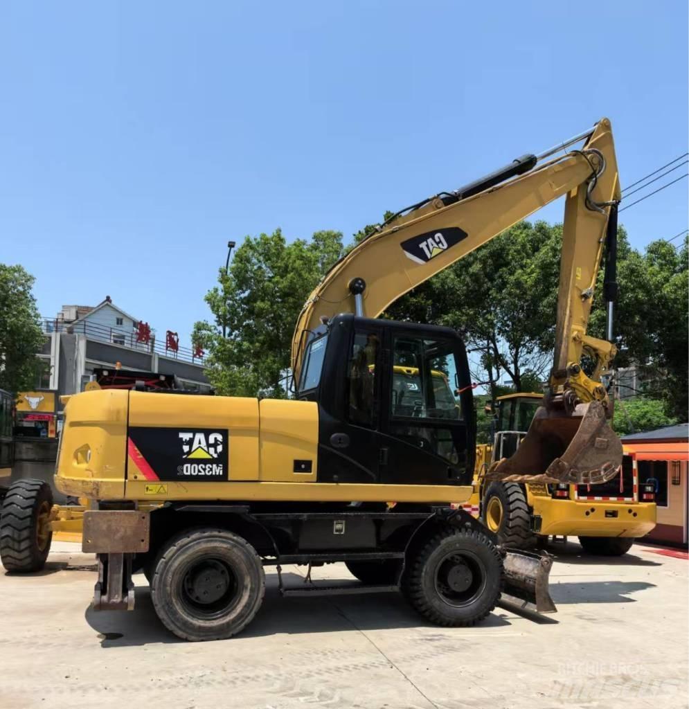 CAT M 320 Excavadoras de ruedas