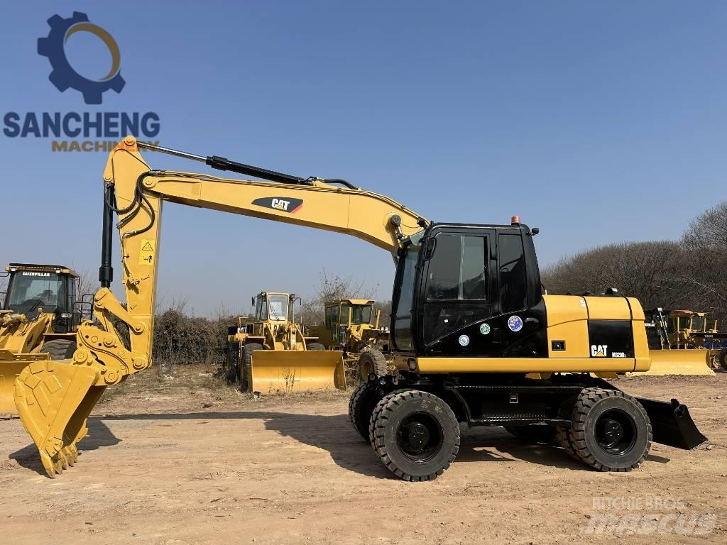 CAT M 320 D2 Excavadoras de ruedas