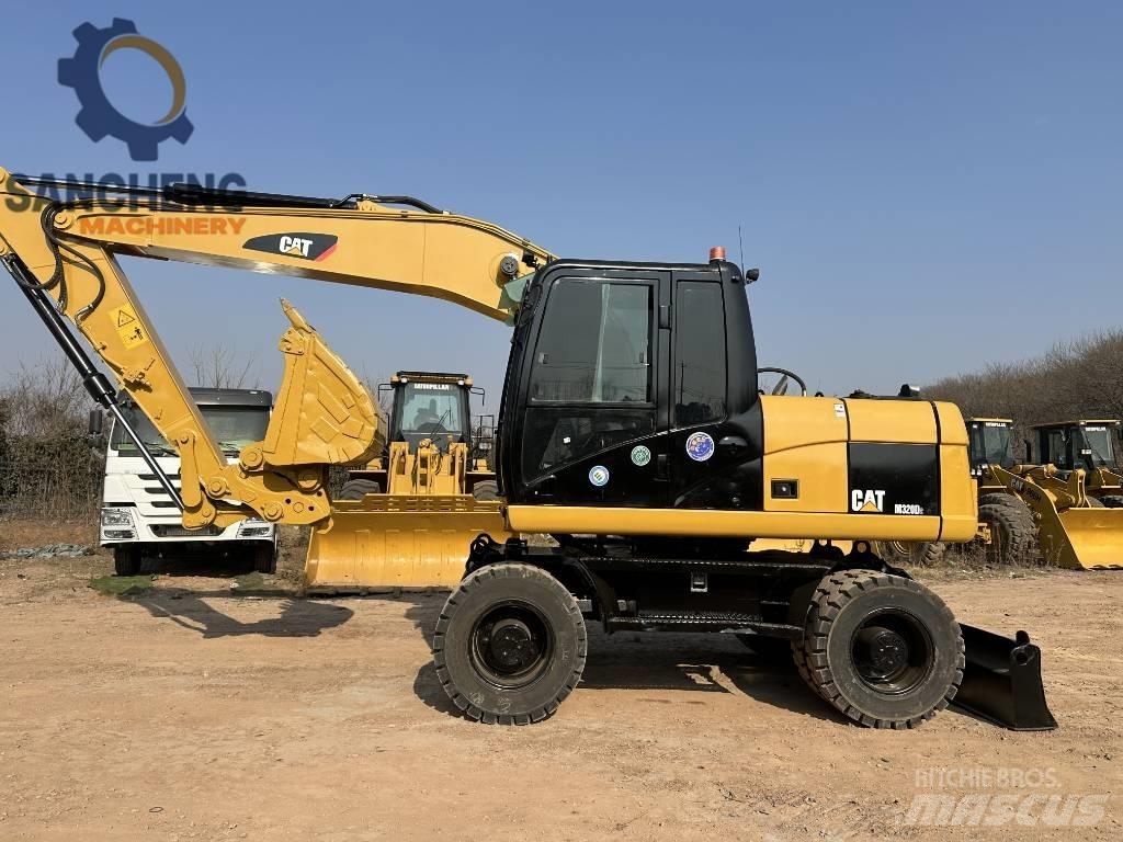 CAT M 320 D2 Excavadoras de ruedas