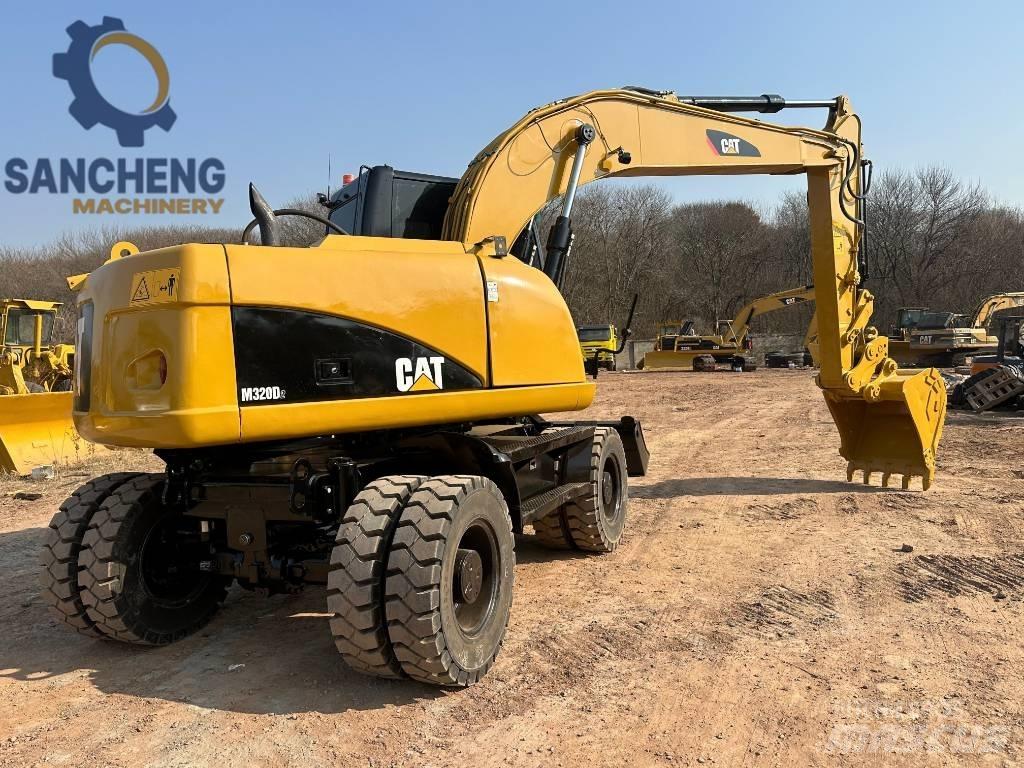 CAT M 320 D2 Excavadoras de ruedas