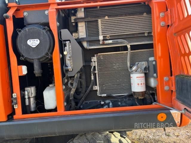  Dosan DX 140 Retrocargadoras